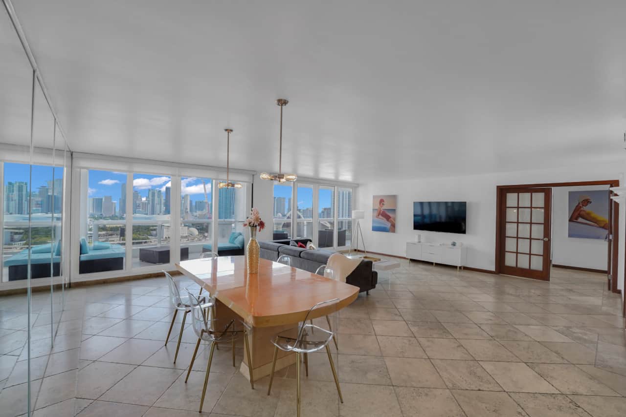 Living room, dining area seating for 6, Roku tv, balcony access