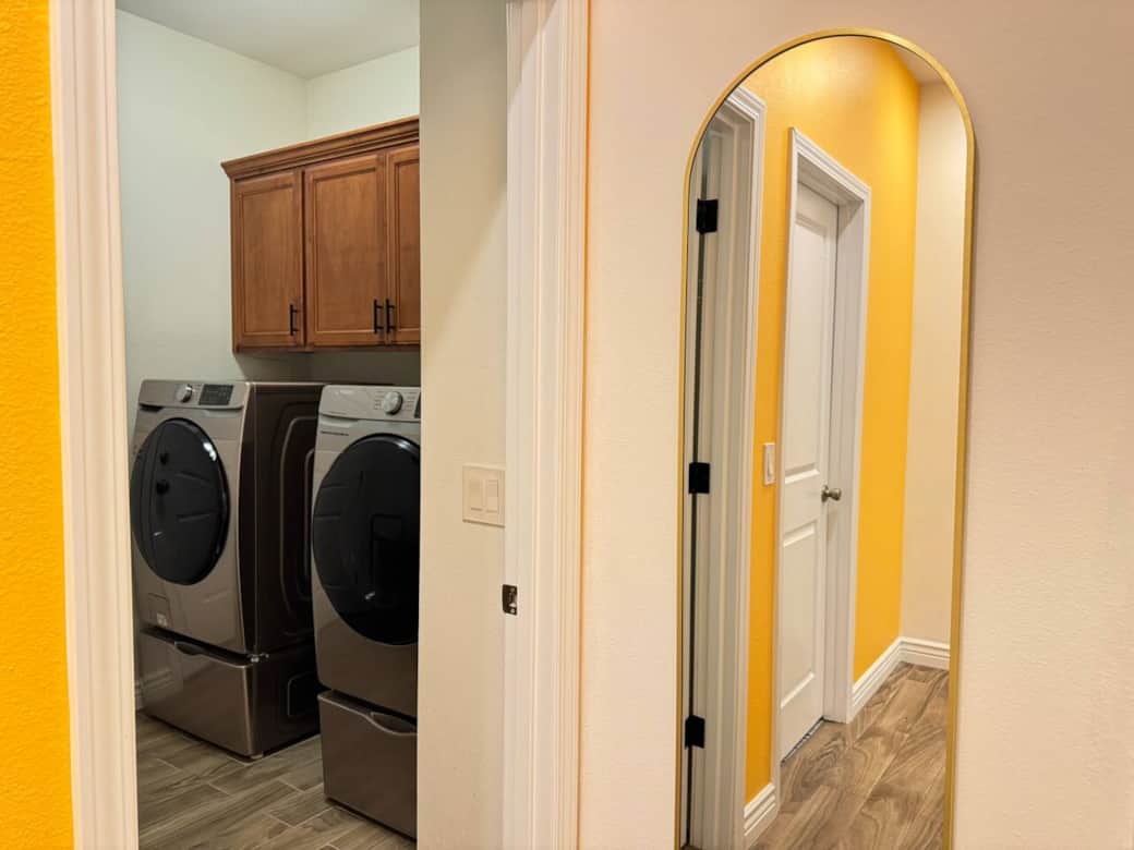 Quiet washer and dryer tucked at the back of the home