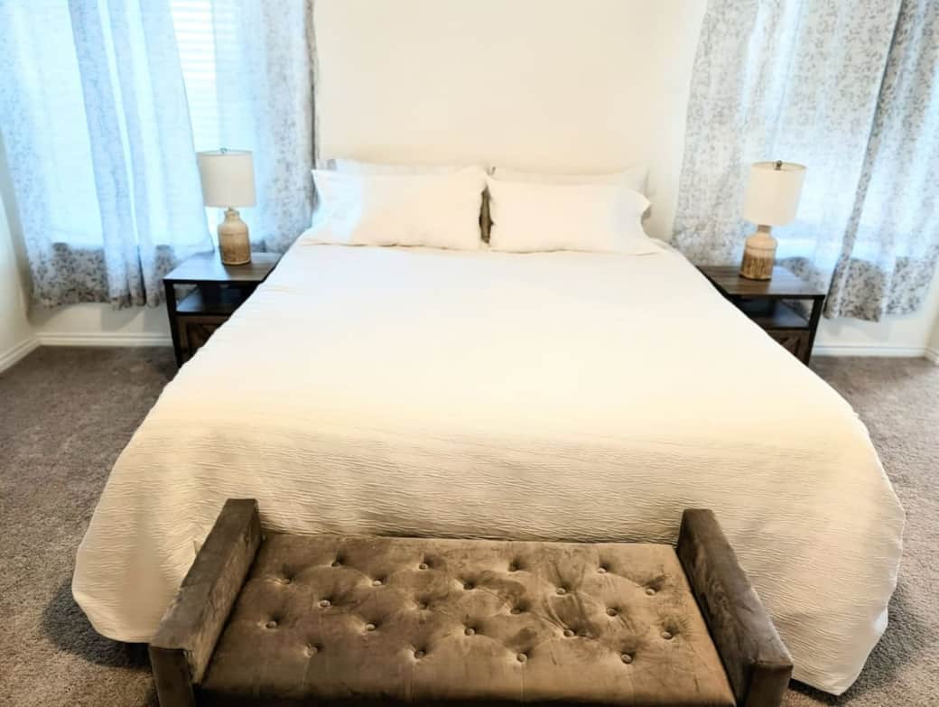 Adjustable king size bed accompanied by two nightstands equipped with USB ports.