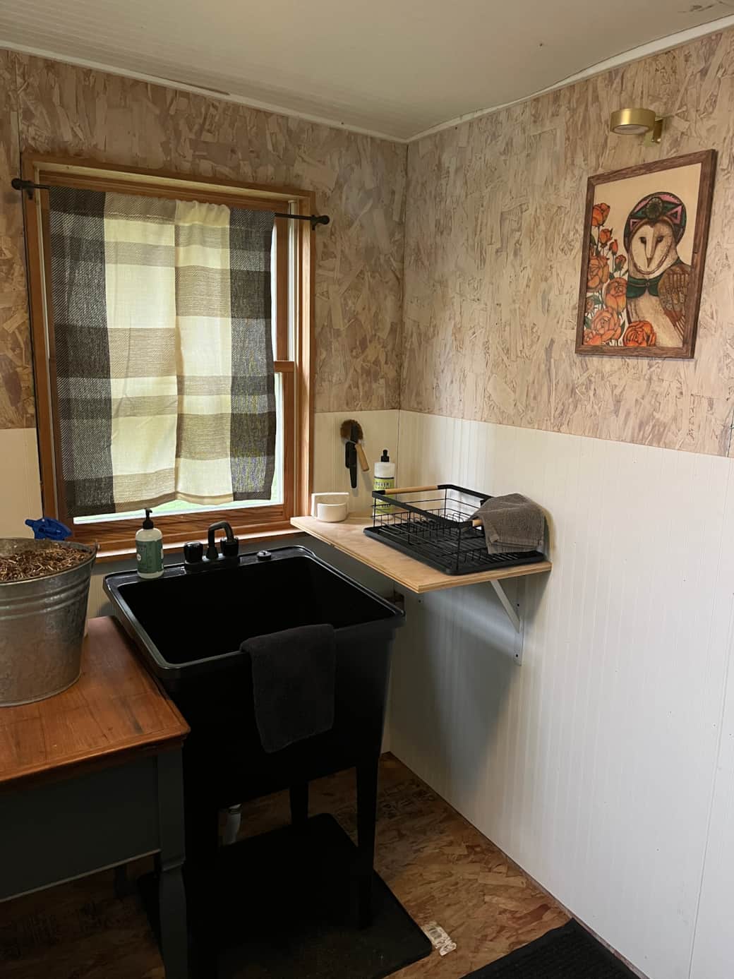 Rustic bathhouse sink and washing area at The Hollow.