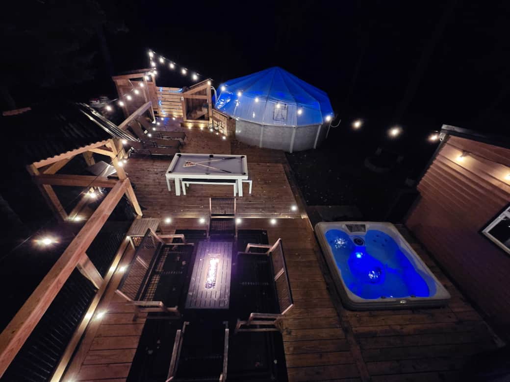 Night time Back yard with pool dome perfect for winter months Night time Back yard with pool dome perfect for winter months