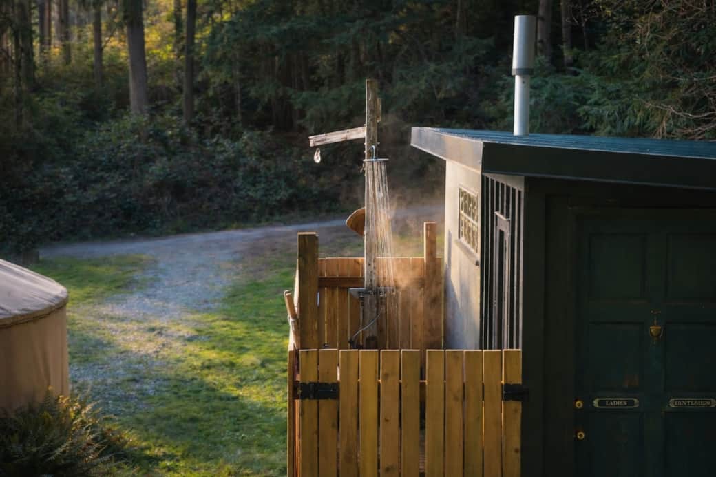 Private outdoor hot-water shower at the bathhouse.