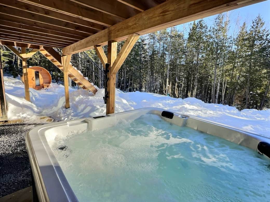 Relax year-round in the private hot tub, nestled in nature-magical in the snow