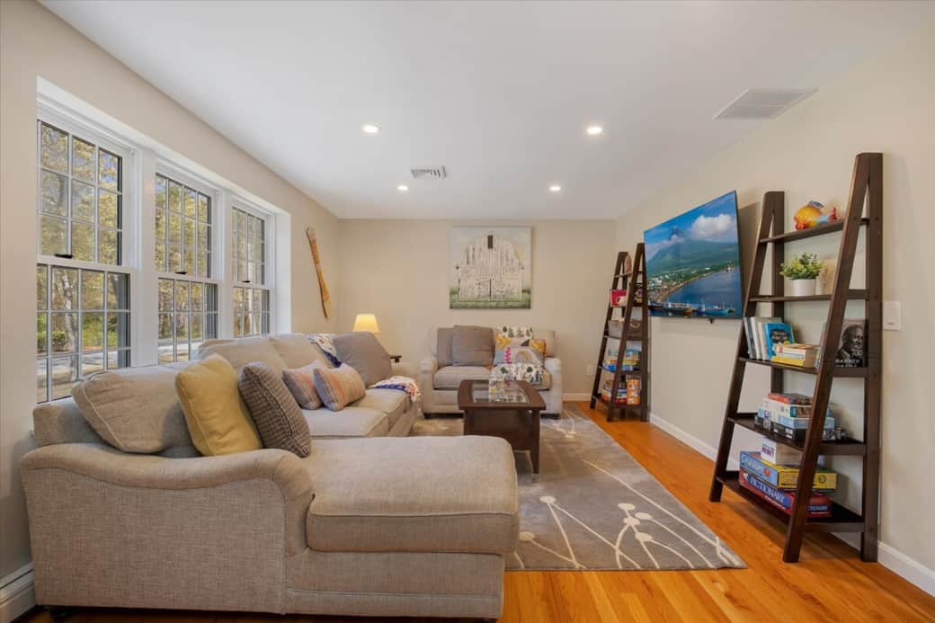 Bright living room with Smart TV and reading nook