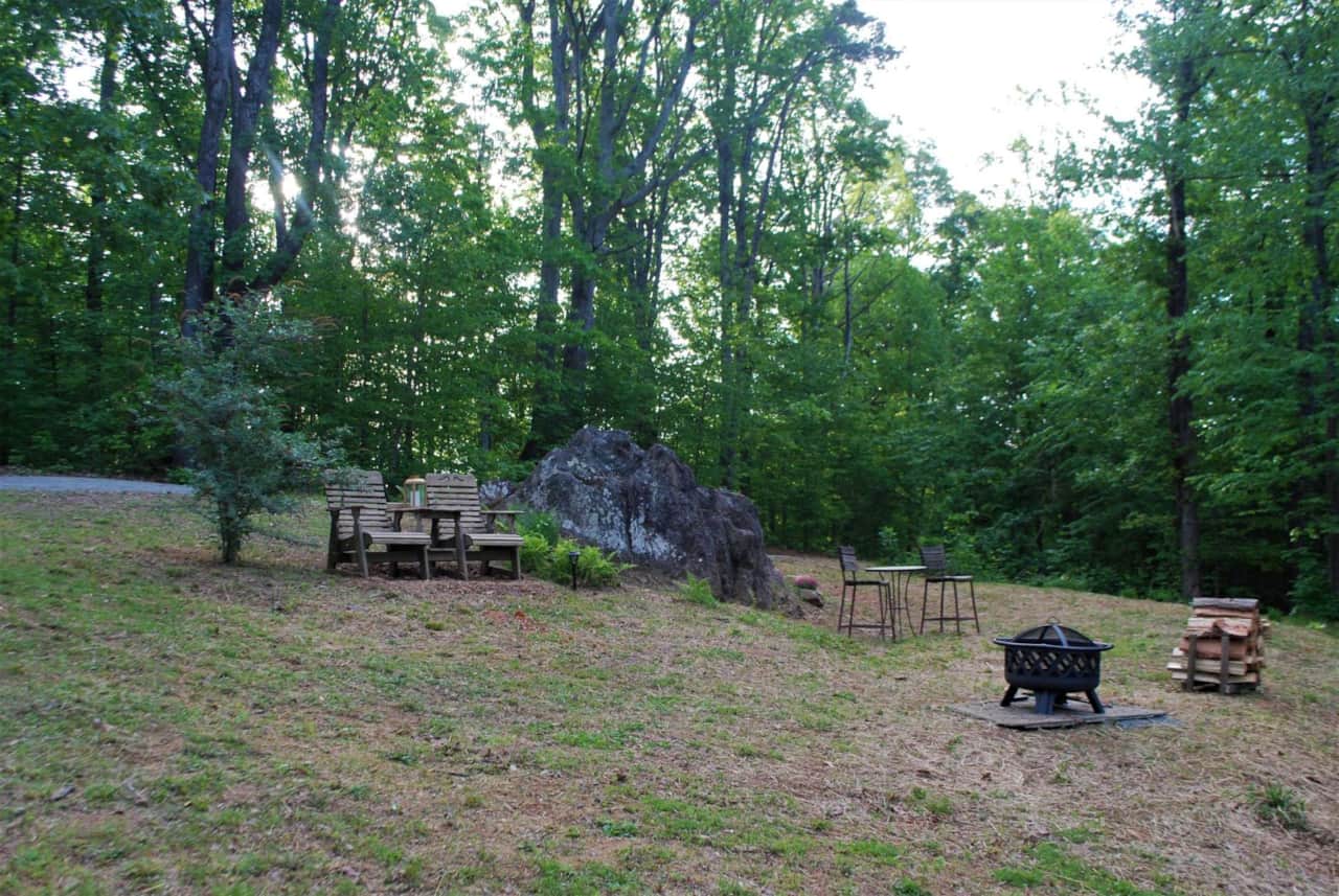 The site comes with a firepit with cooking grill, table for two and some firewood is included