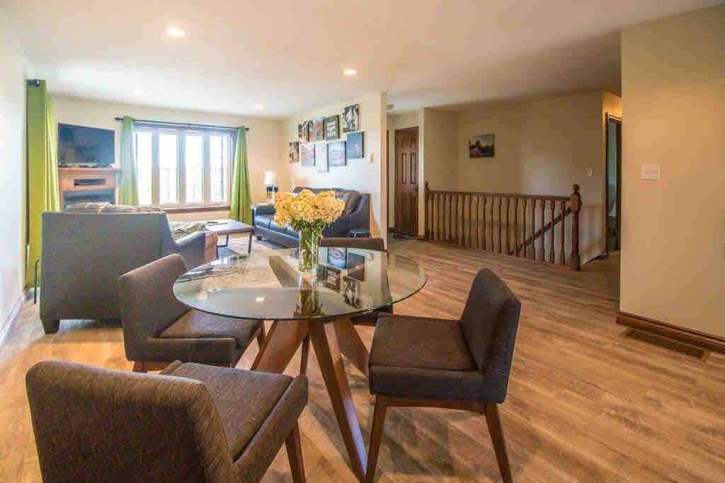 View of living room/entry from coffee bar