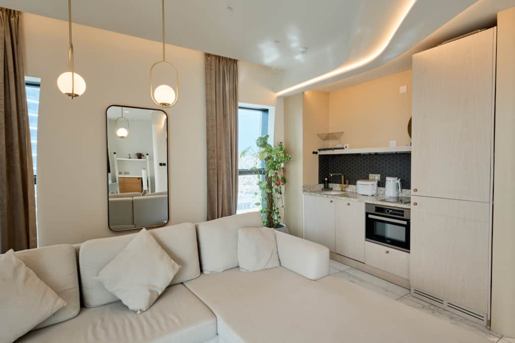 Minimalist Kitchen and Cozy Lounge Area Minimalist Kitchen and Cozy Lounge Area