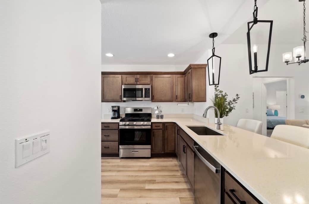 Kitchen with quartz counters and eating bar