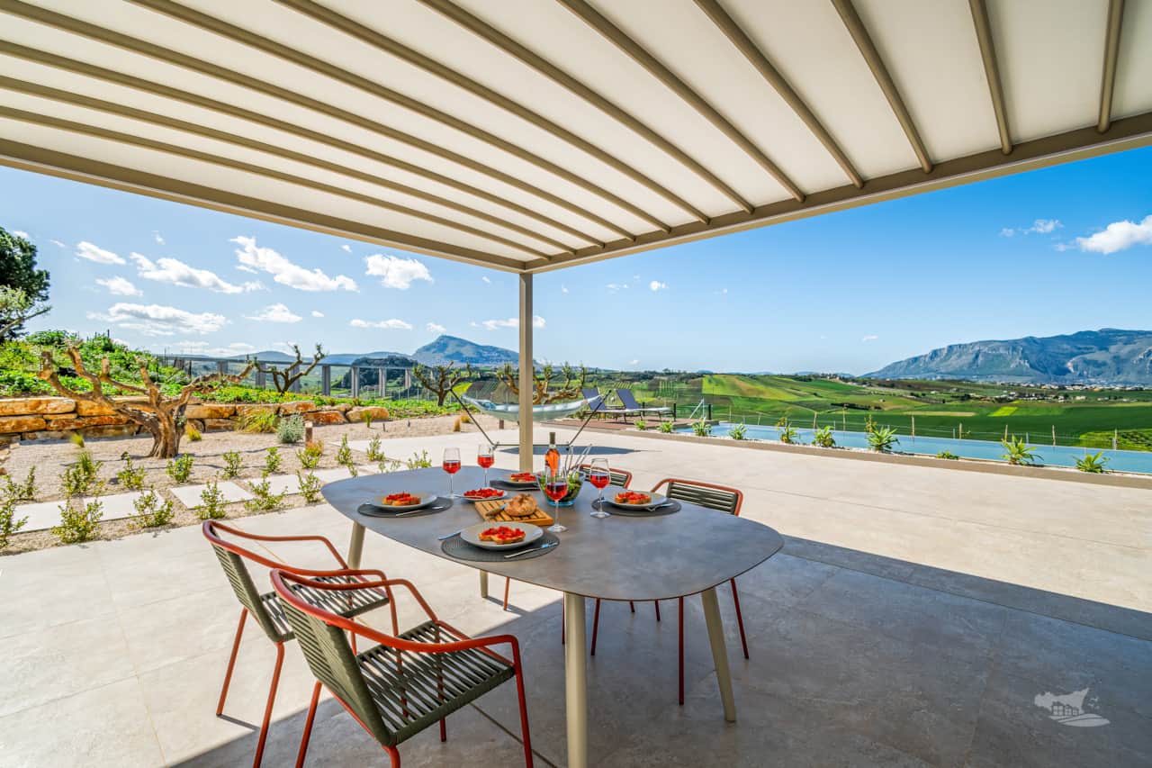Dine al fresco with breathtaking views of Sicily’s rolling hills and majestic mountains.