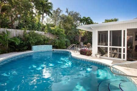 Easy access into the private and heated concrete pool.