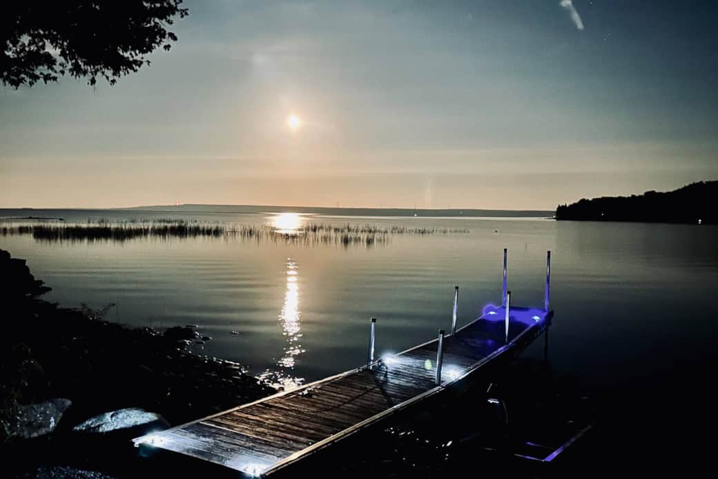 Stunning moonlit waterfront with a private dock — perfect for evening relaxation.