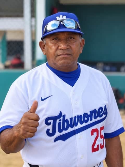 José, the property caretaker, wearing his baseball uniform