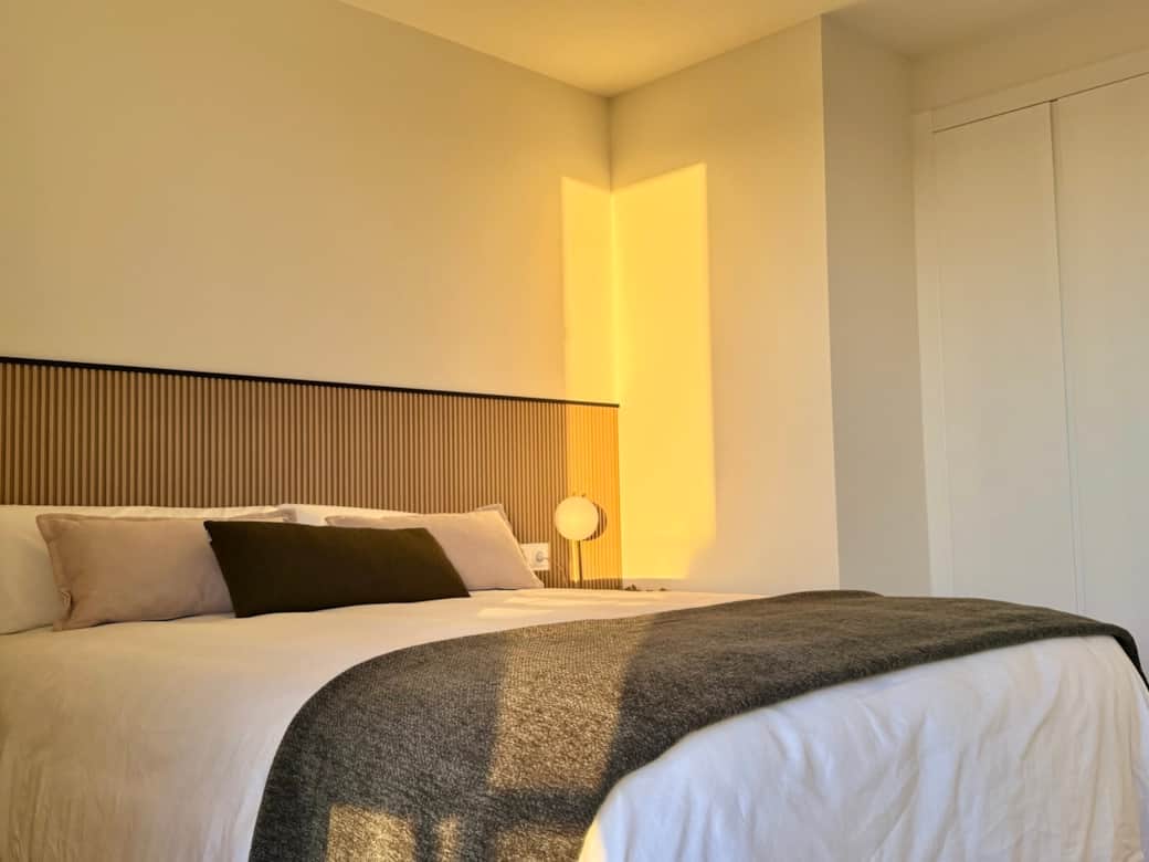 Wake up to sea views and balcony access directly from the comfort of your bed