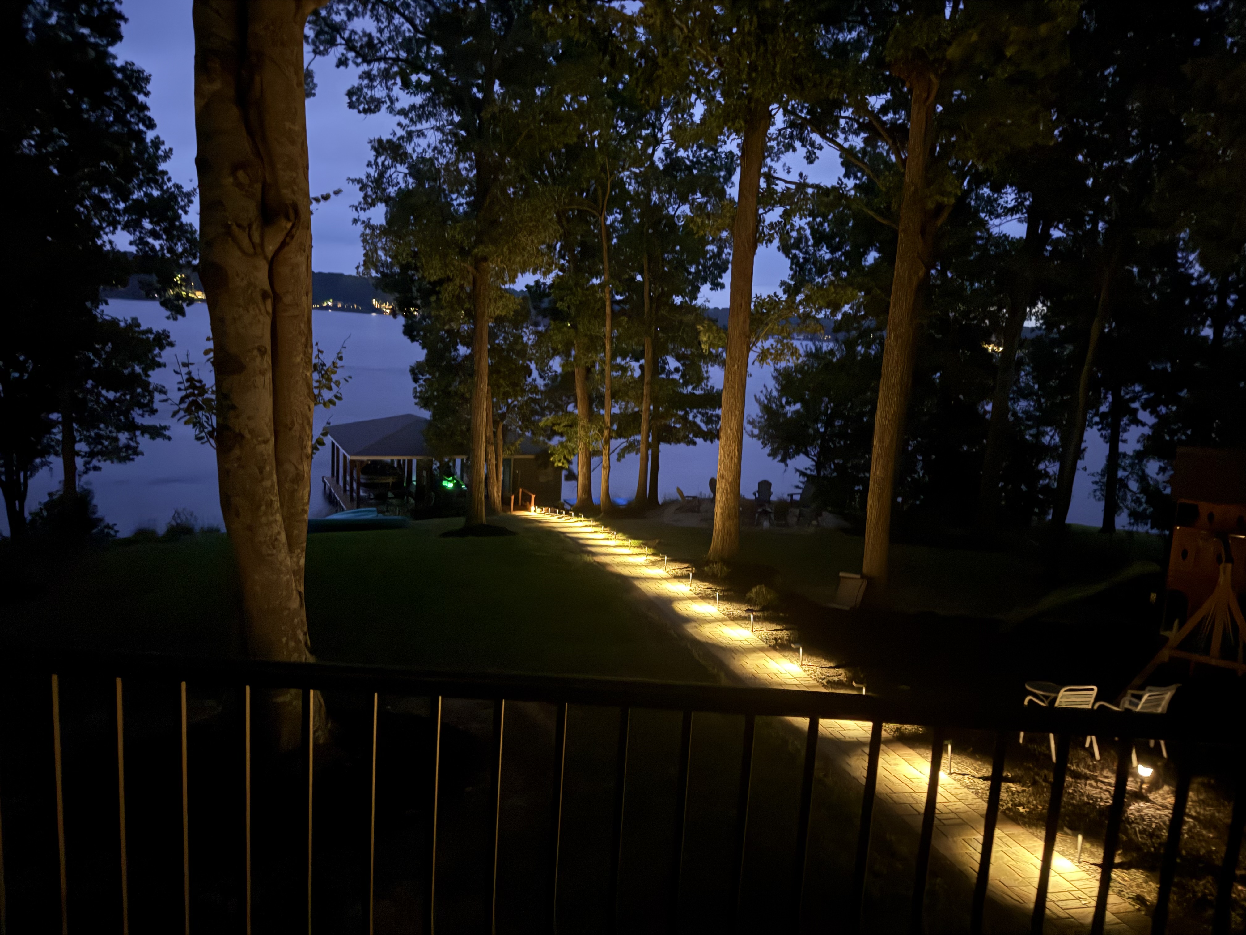 lighted hardscape pathway from the house to the lake
