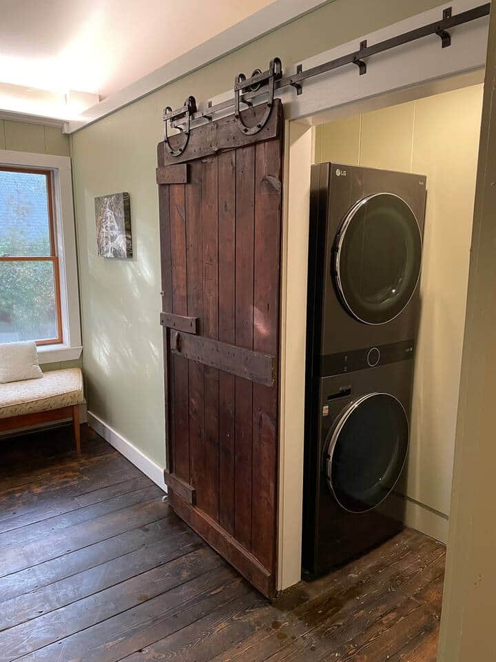 Full size washer and dryer (new summer 2021). The door is original to the property (1850s) and was moved from the schoolhouse (one of the other connected buildings).