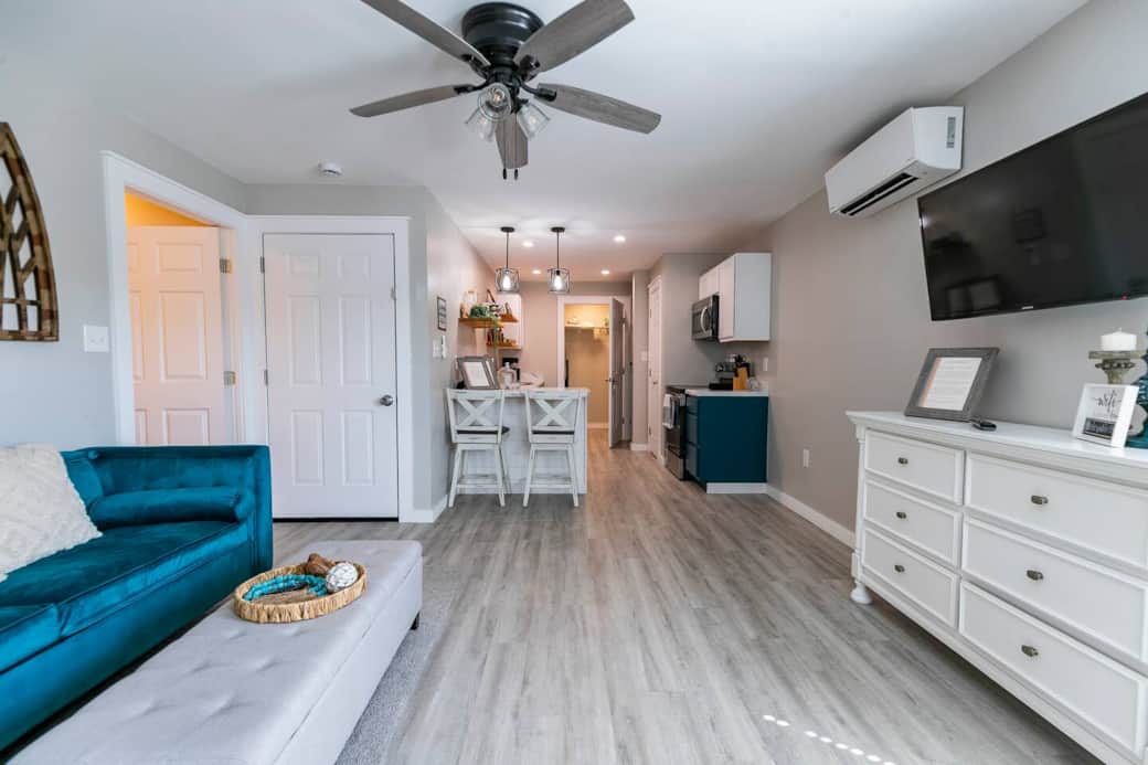 Welcome to your home away from home. This is your view once you have entered the front door. From the foyer, you have the living room / kitchen combo. On your left is the door to your bedroom. 