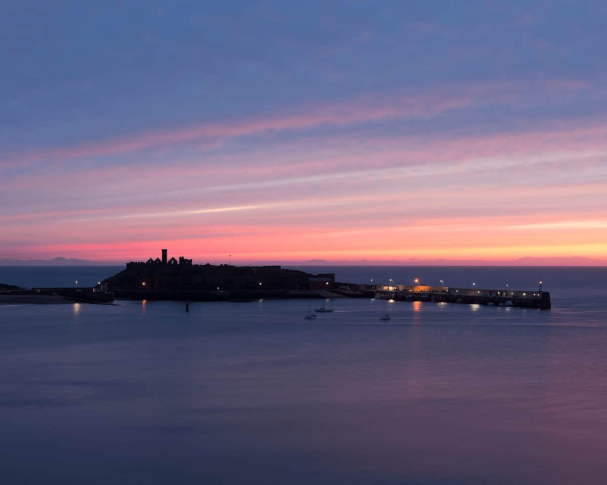 Sunset over Peel harbour and the castle