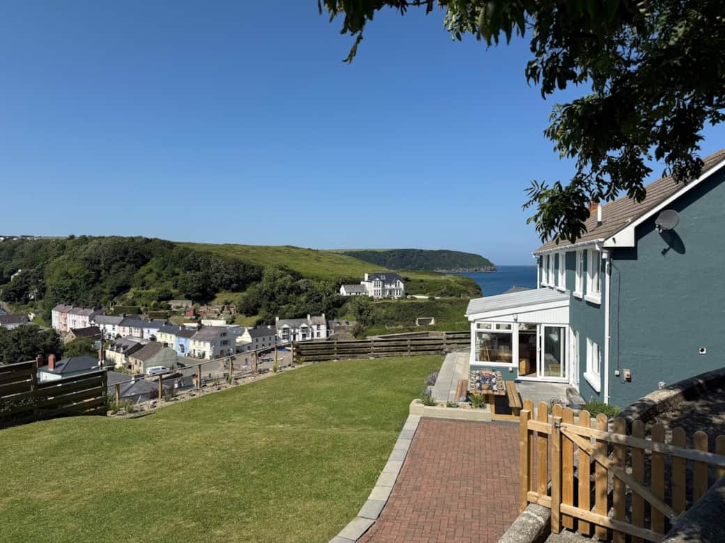 The  stunning sea and Little Haven village view from the fire pit terrace. Dogs and kids love the safe enclosed garden. Al fresco dining with a view.