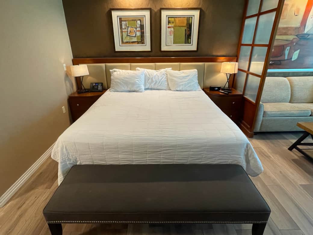 Bed with bench and side tables