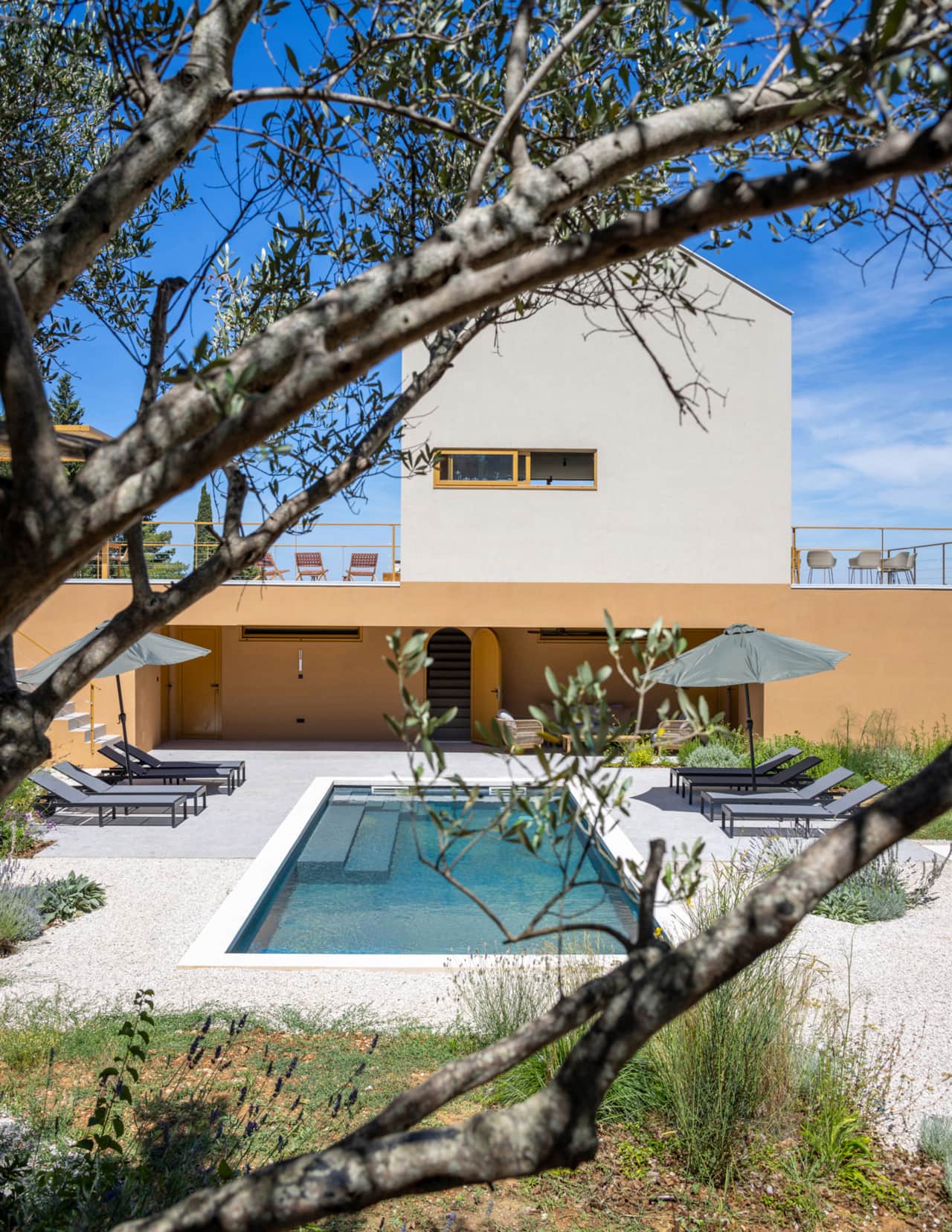 Beautiful pool overlooked by shady loggia