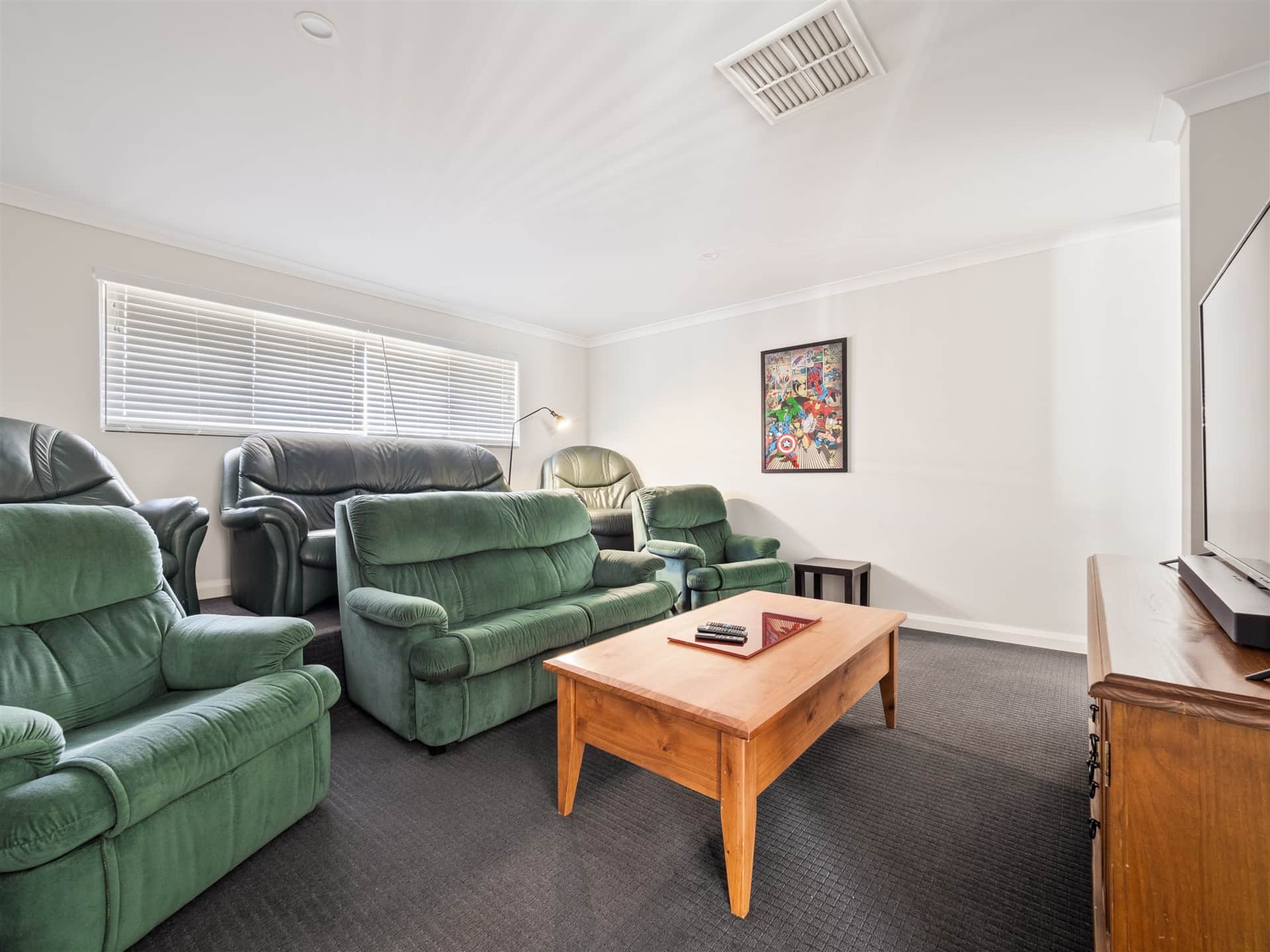 Home theatre with tiered seating, 75 inch television with all streaming apps and game console connection