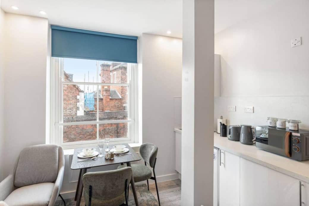 A bright, modern bedroom with a luxurious double bed, dining space for two and Smart TV with Netflix A bright, modern bedroom with a luxurious double bed, dining space for two and Smart TV with Netflix