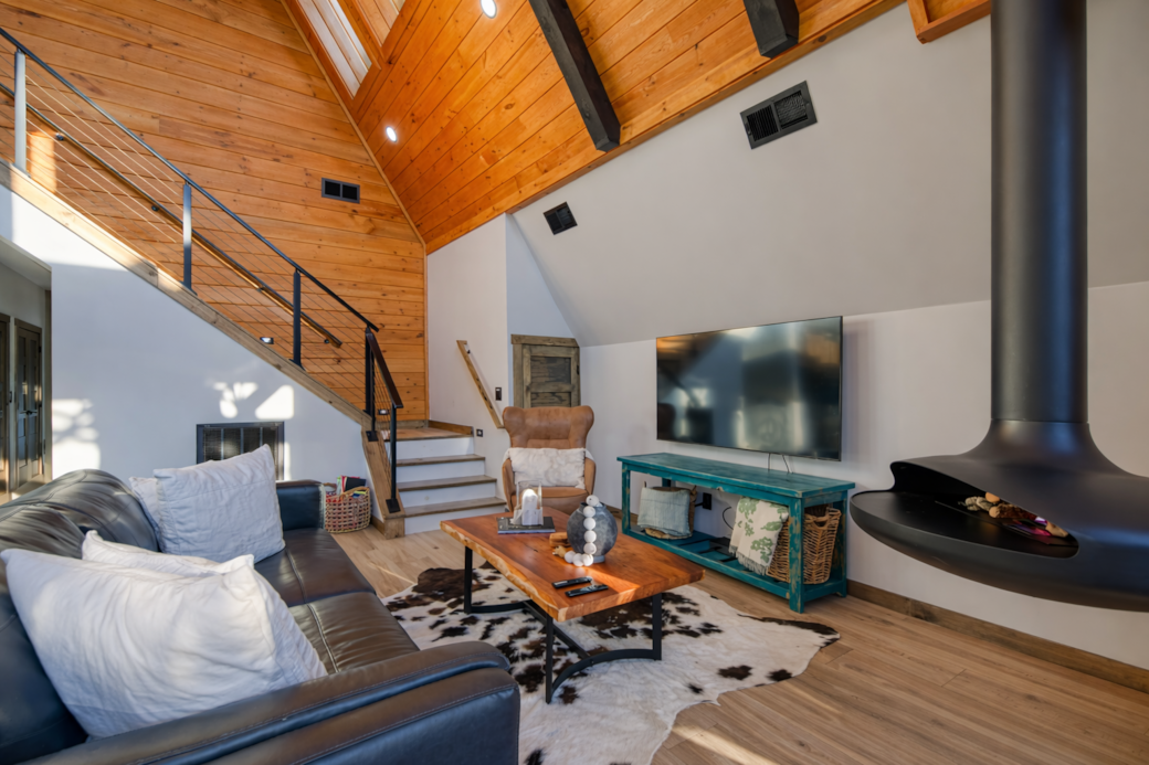 Relax by the hanging trumpet fireplace with wine or enjoy cozy movie nights.