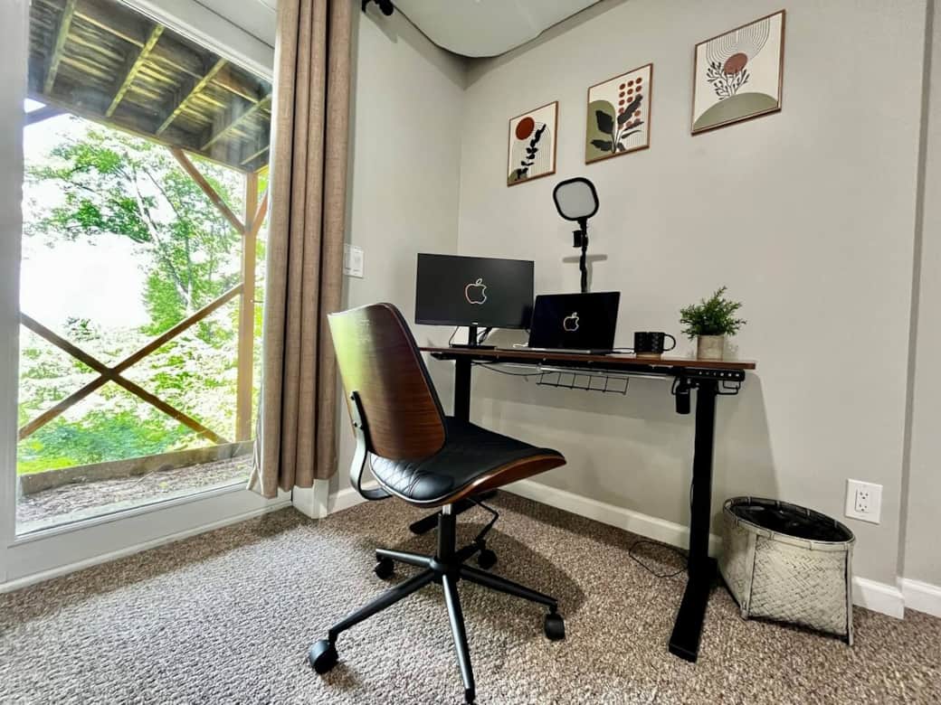Need a place to work. We have an electric standing desk available for you. You'll find a comfortable leather chair as well as a 24" monitor and a video conferencing light. All this right beside the patio window offering a great view of the mountains.