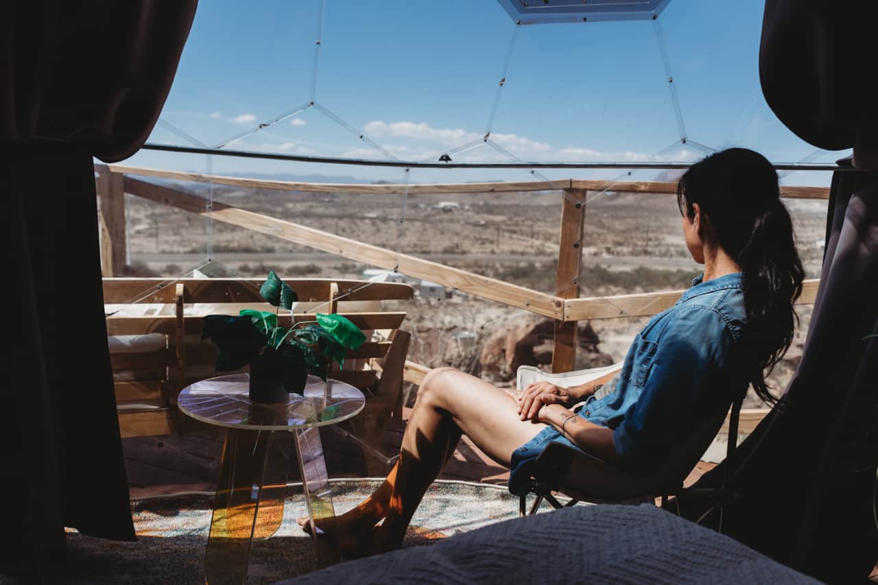 Relaxing with desert views inside Space Pod 007