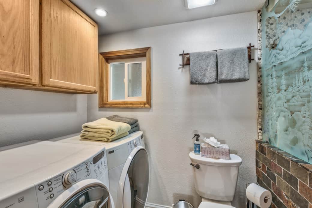 Hall guest bathroom with laundry area Hall guest bathroom with laundry area