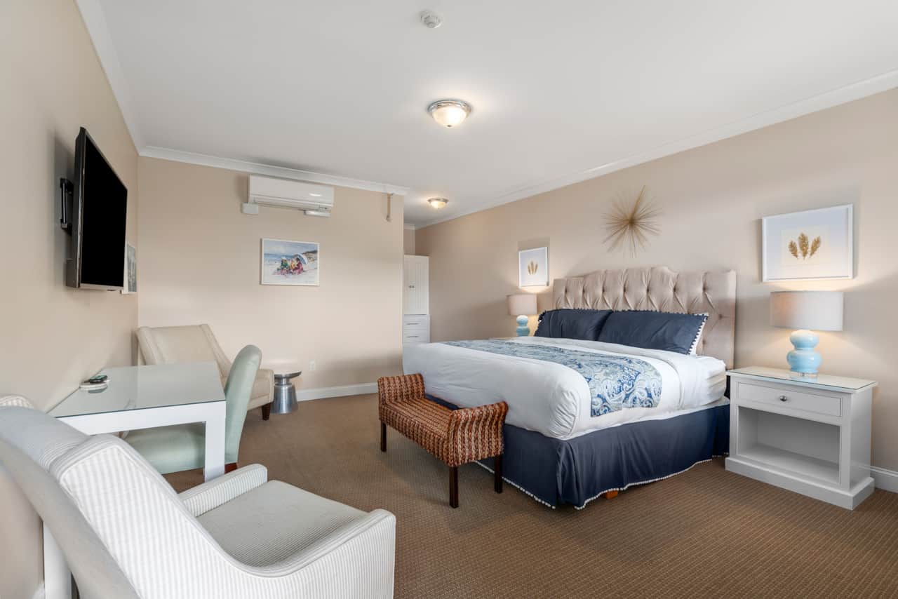 King bedroom with tall ceilings, private entrance, cable TV, and clean provided linens