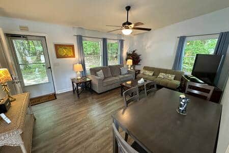 Living room with peaceful nature views and it has a futon. Tv gaming system with 10,000 games Living room with peaceful nature views and it has a futon. Tv gaming system with 10,000 games