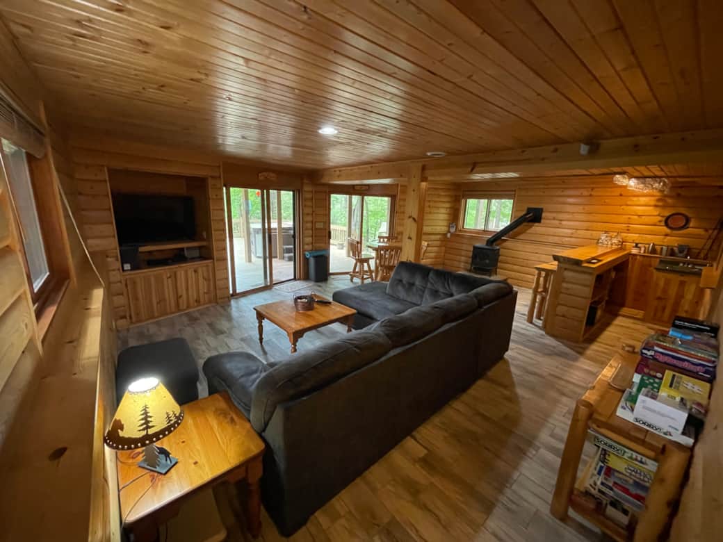 Full family room in basement with games and wet bar
