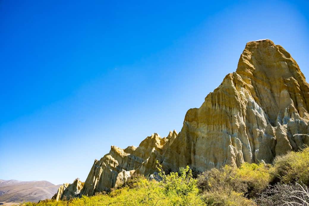 These natural rock formations are just 10 km west of Ōmrama. The Clay Cliffs are a stark sight - tall pinnacles separated by narrow ravines.  A short 35 minutes drive to the Clay Cliffs --- a walk you will be amazed at.