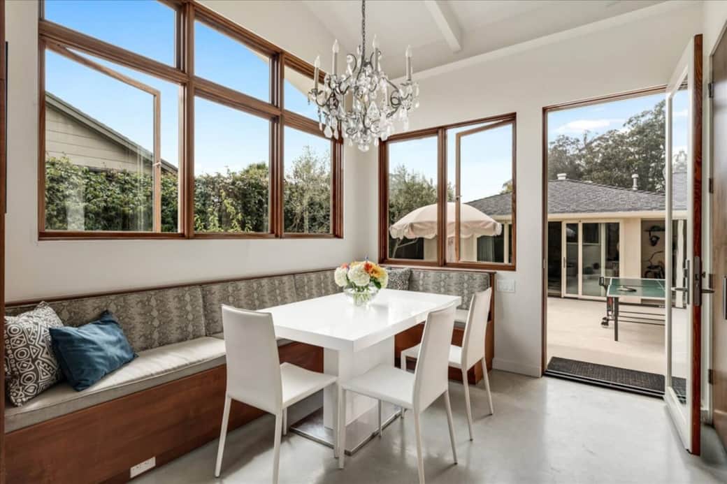 Extendable dining table under the french chandelier