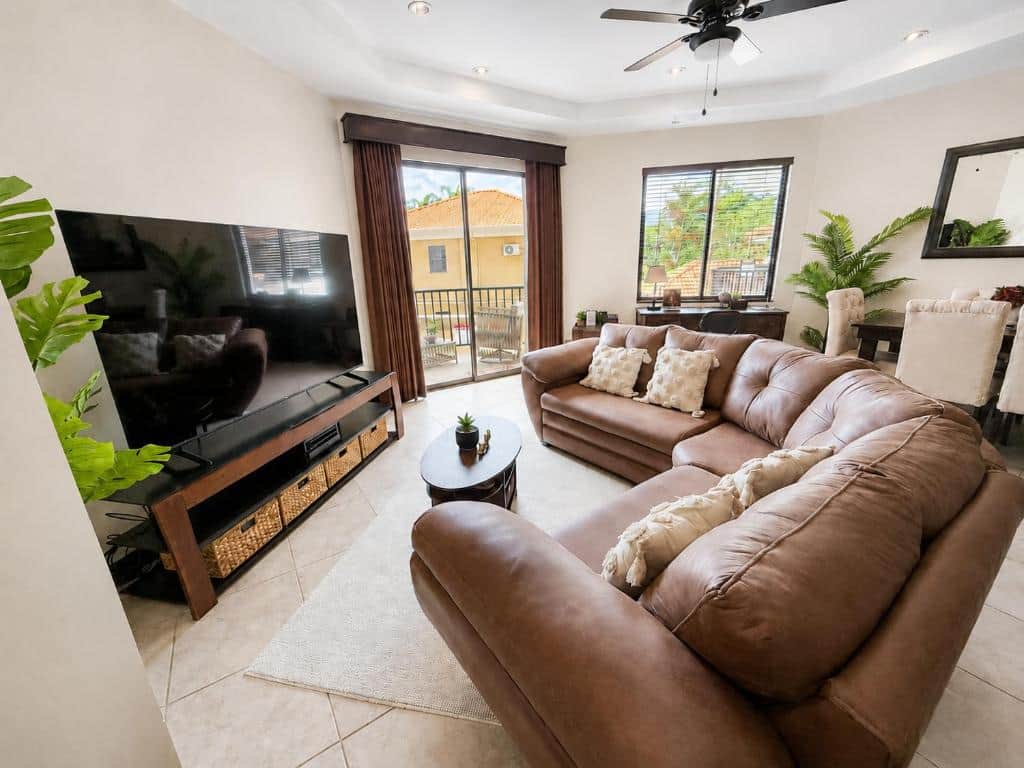 Monaco condominiums 3BD 2 BA living area with large smart TV and pool view Monaco condominiums 3BD 2 BA living area with large smart TV and pool view