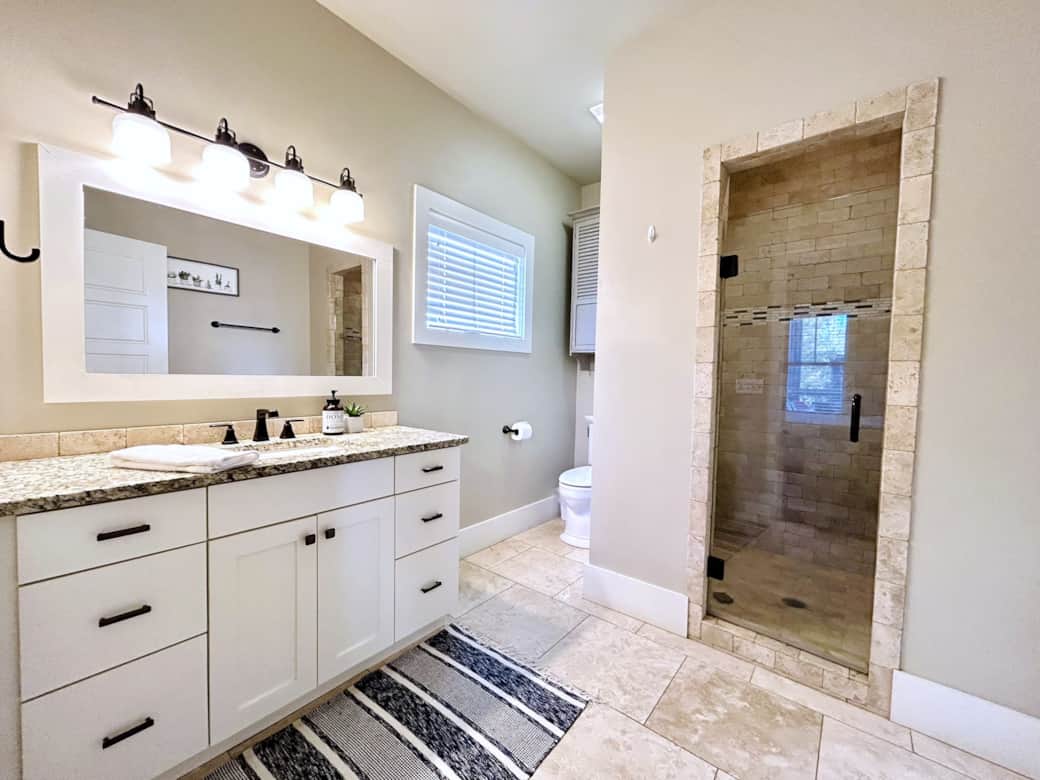 En-suite master bathroom is stocked with deluxe toiletries & spa-soft towels.