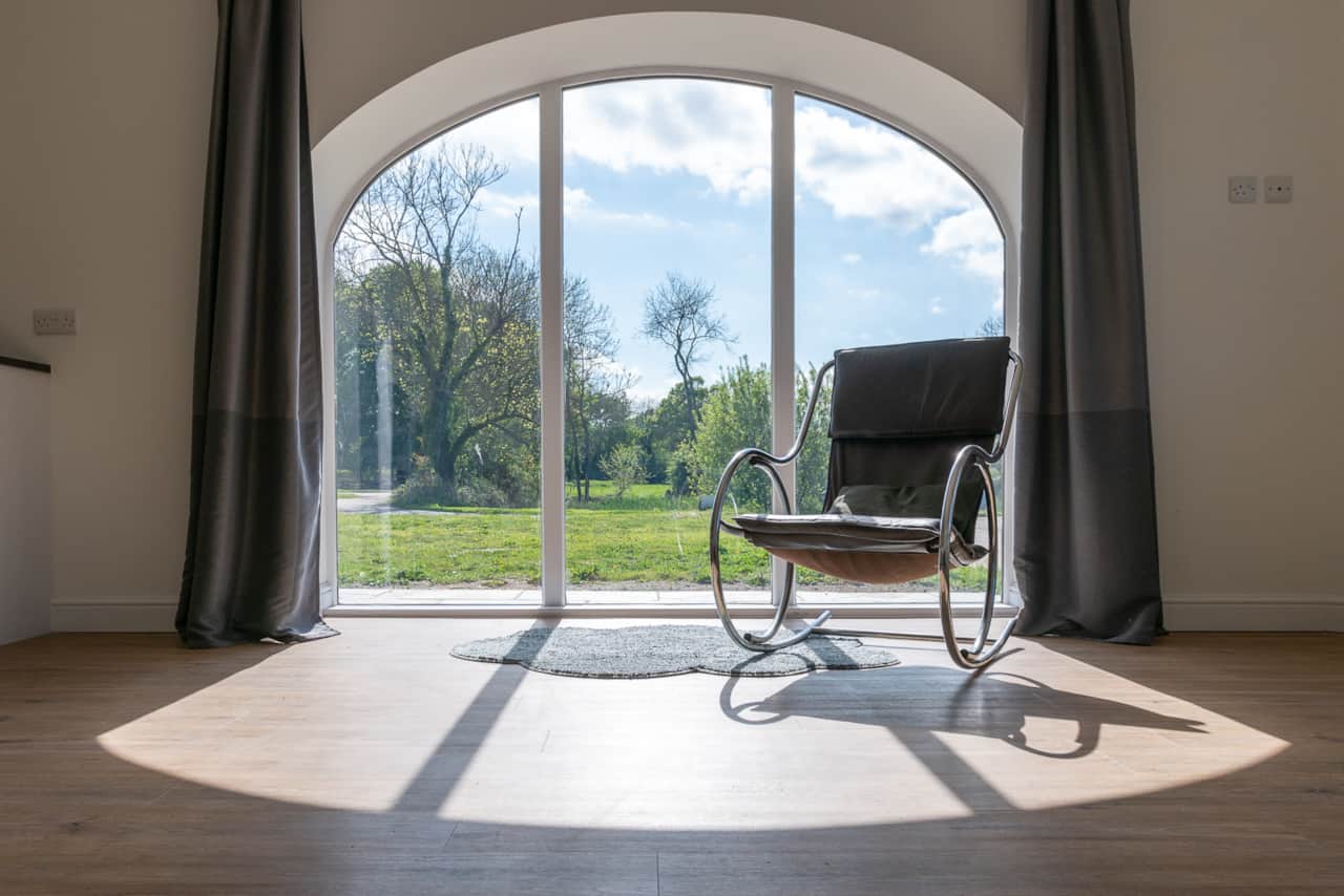 Views over the countryside and private lake from the cottage's living space