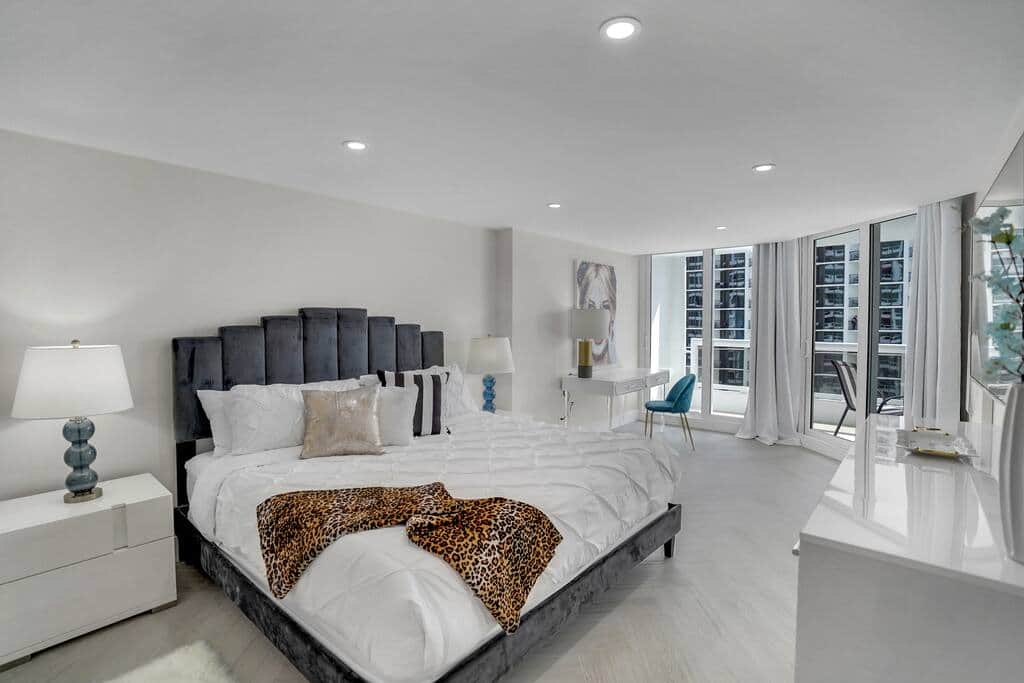 Master bedroom suite, king bed, balcony access, Roku tv, desk, walk in closet, private bathroom