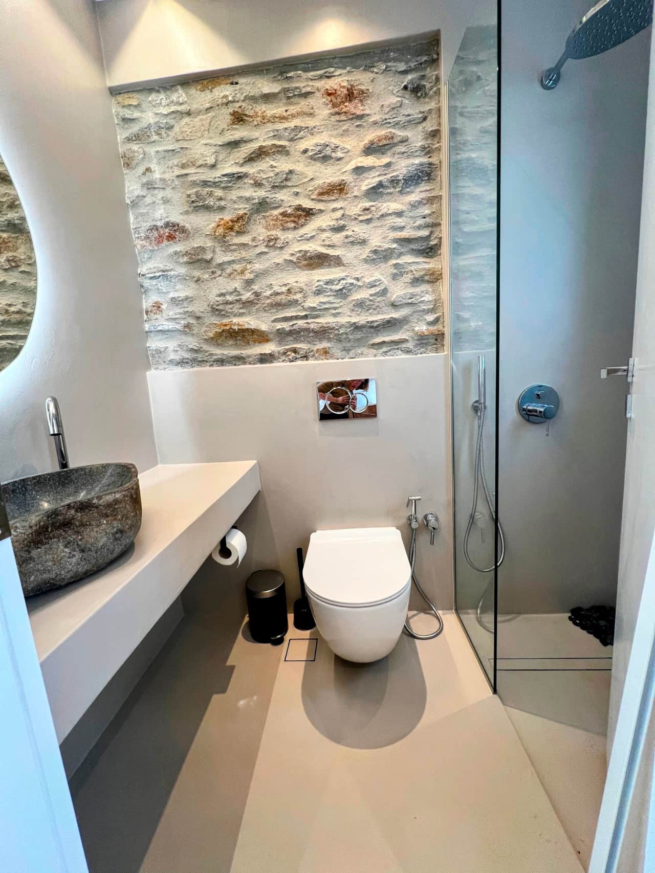 Modern bathroom with stone basin and shower, minimalist design, holiday rental, Kea