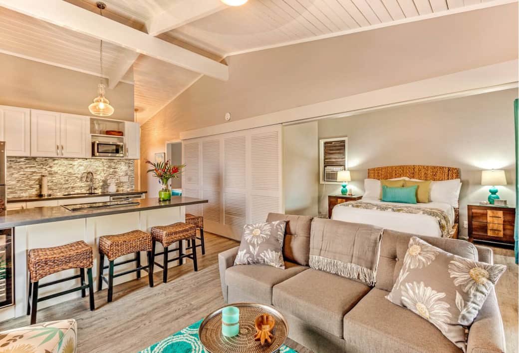 Livingroom area has a full sofa and two slipper chairs. Livingroom area has a full sofa and two slipper chairs.