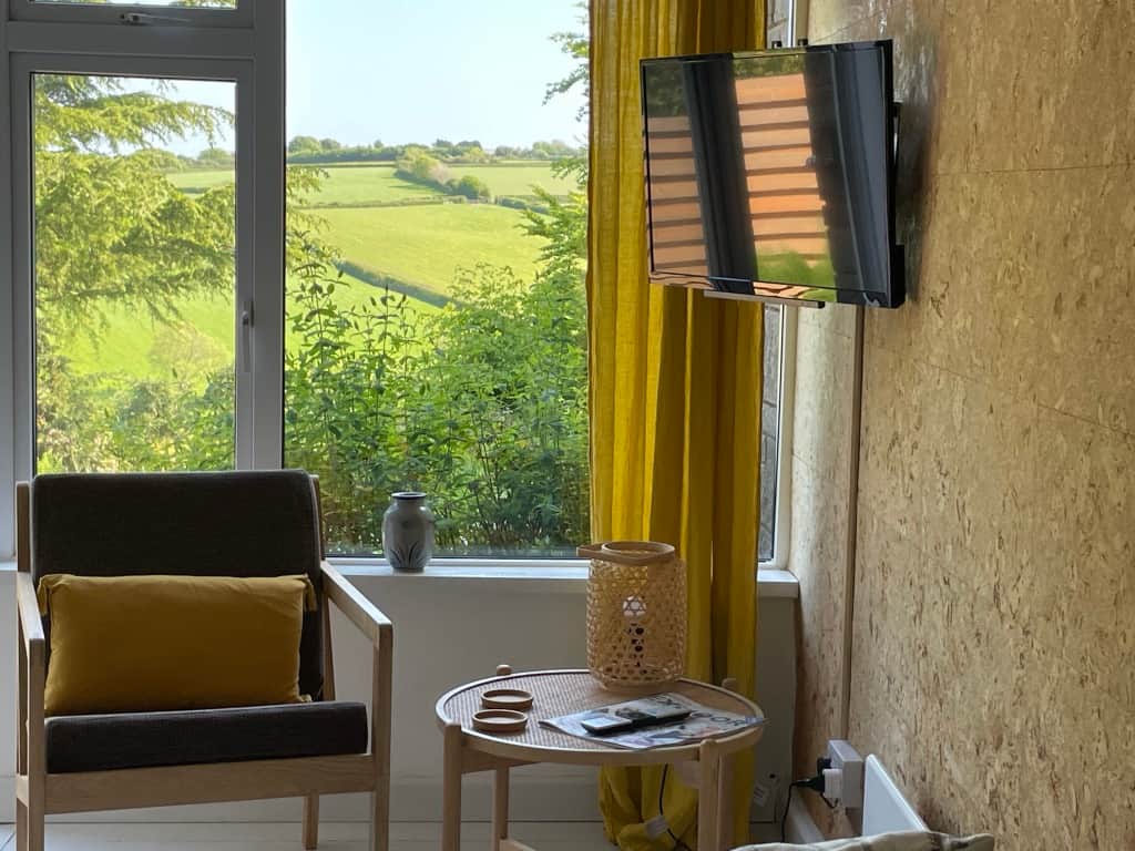 Living area with picture windows and views towards Exmoor