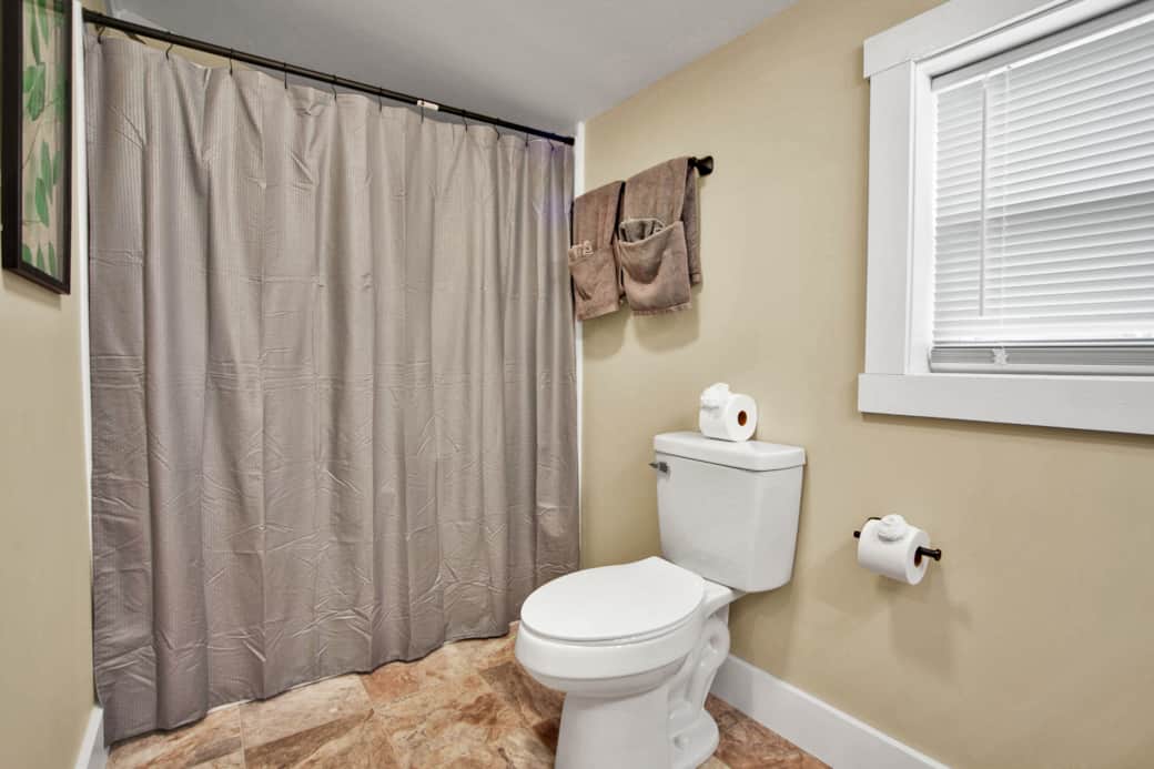 Bedroom 1 -Queen bed, attached bathroom with walk in shower, hairdryer available