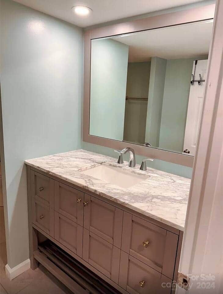 Recently updated downstairs bathroom with a beautiful tiled shower and glass enclosure. Recently updated downstairs bathroom with a beautiful tiled shower and glass enclosure.