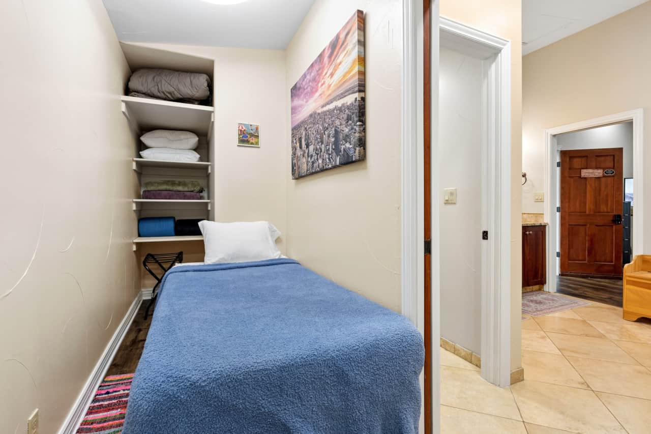 Second bedroom — two twin beds, made for kids