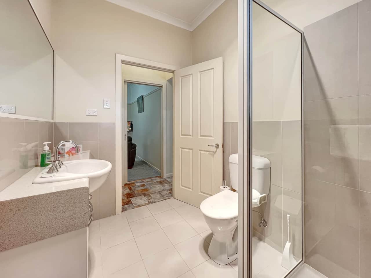 ndulge in our modern bathroom with a sleek walk-in shower for a refreshing stay.