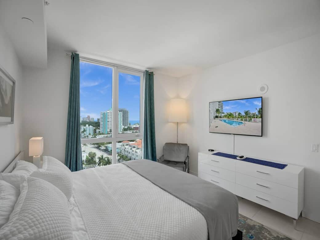 You'll want to go to bed early.   Floor to ceiling window with black out shades and window treatments.  