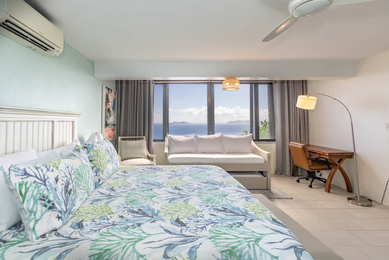 Large Bedroom With A Spot To Read, Sleep, and Work