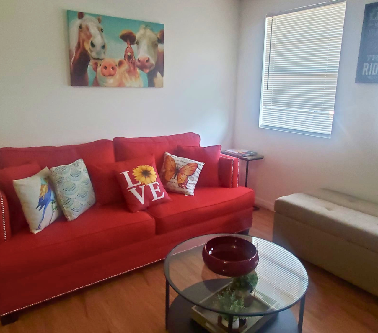 Spacious, sunlit living room with modern style and cozy seating. Lakeland, FL