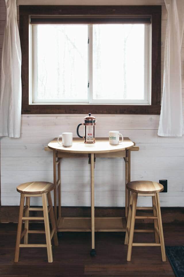 dining table opens to pull out two more stools